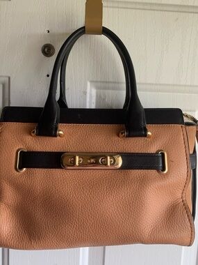 Tan and Black Women's Swagger Handbag with Gold Hardware